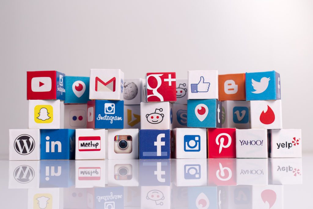 Sakarya, Turkey - August 19, 2015: Social media logos printed onto cubes. Logos include Periscope, Instagram, Linkedin, Swarm, Snapchat, Yelp, Reddit, Flickr, Yahoo, Dropbox, Blogger, Meetup, Google Plus, Youtube, Tinder, Digg, Gmail, Pinterest, Twitter and Facebook. Social media uses web and mobile technology to connect people.